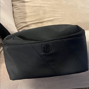 Black crossbody nylon passport sling pouch by Joan and David